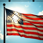 Pray for America at Hope Filled Faith. Picture of American flag on a flagpole against a blue sky with the sun behind it.