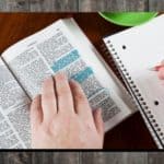 Bible verses for college students - someone studying the Bible with a spiral notebook next to it - a post at Hope Filled Faith