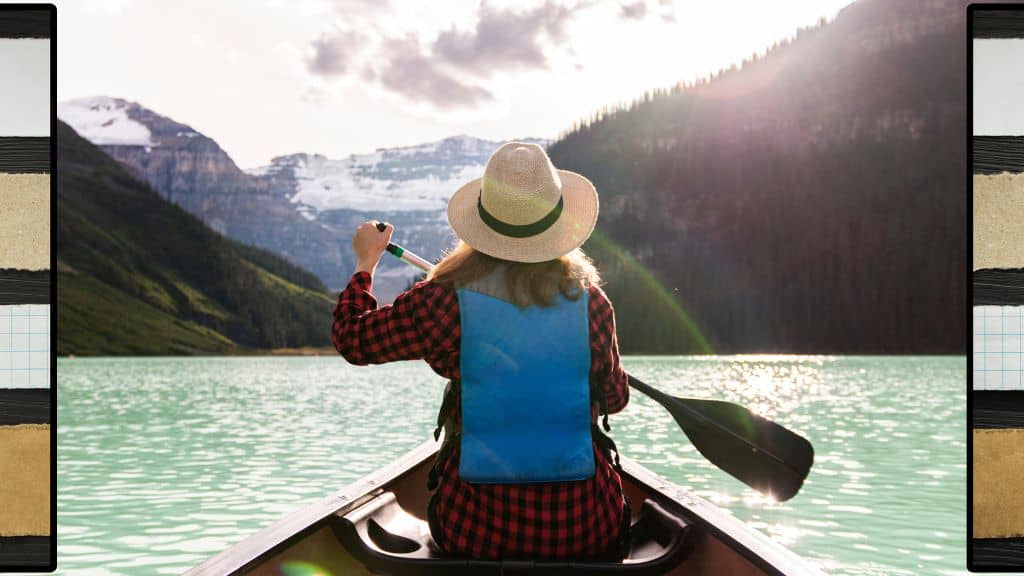 3 ways to find rest in Christ - woman paddling out on the water towards mountains - hope filled faith