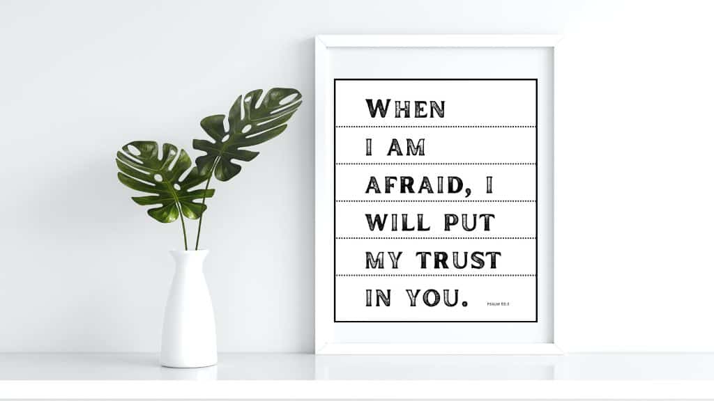 mockup of black and white printable Bible verse wall art of Psalm 56:3 at Hope Filled Faith. Picture by a vase of leaves
