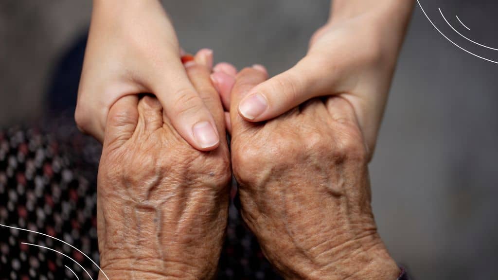 September Prayers (4) closeup of young hands holding elderly hands