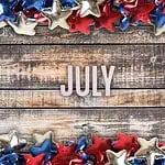 July letters on a wooden background with red white and blue star borders - Bible verses for July