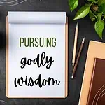 pursuing godly wisdom on clipboard on a cluttered desk