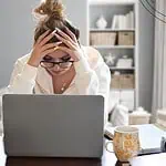 2 - woman looking overwhelmed at computer - a prayer for the overwhelmed