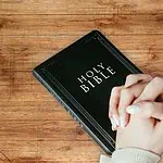 1 - Prayer Points for Mothers - women's hand praying on top of Bible