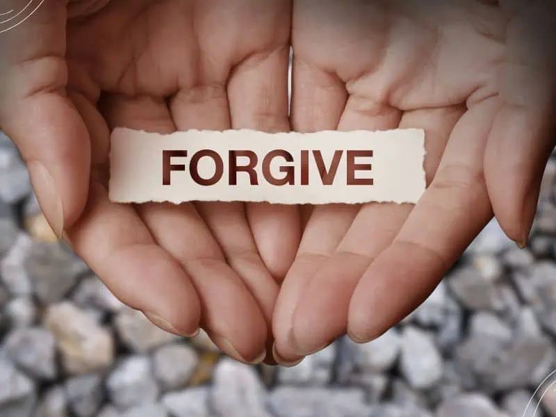 Bible verses about forgiving - hands holding the word forgive