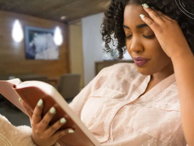 Bible reading plans - woman reading Bible inside